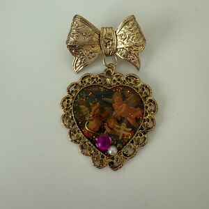 Gold Heart Pendant with Bow Accent